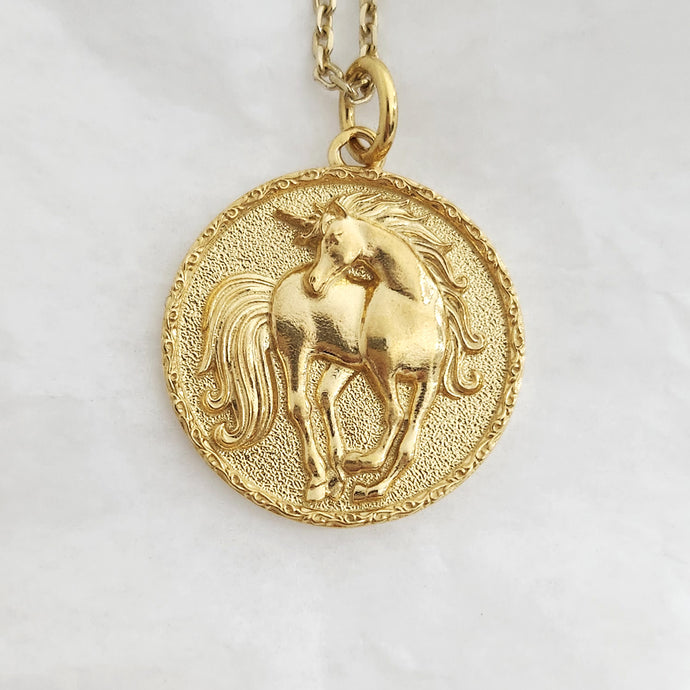 unicorn pendant necklace in 14k and 18k gold for women and men, with a circle shape