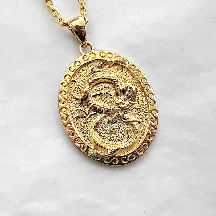 men's dragon pendant necklace in 14k and 18k gold, with an oval shape